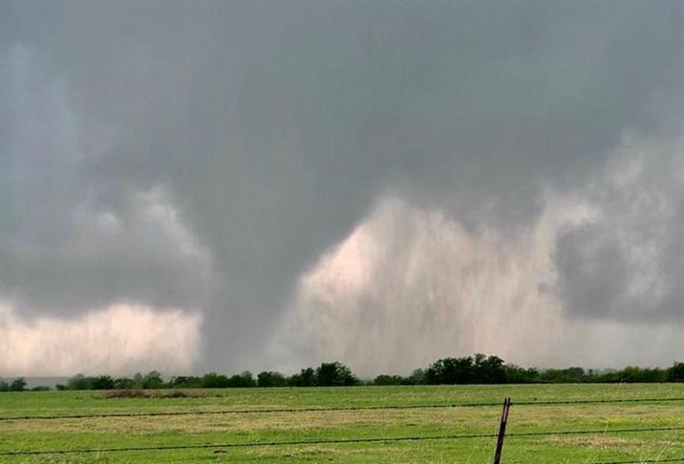 Tornadoes, hail and flash flooding spread damage across central US